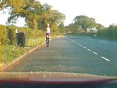 Mature shemale walking on a road